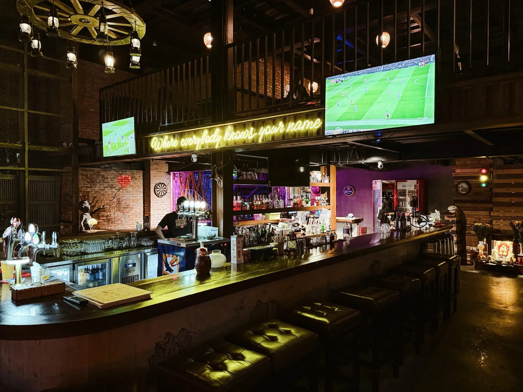 The Cheers bar with football playing on the screens