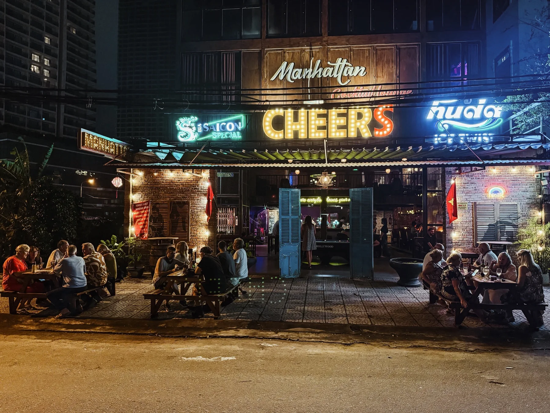 The illuminated Cheers Pub and BBQ entrance at night
