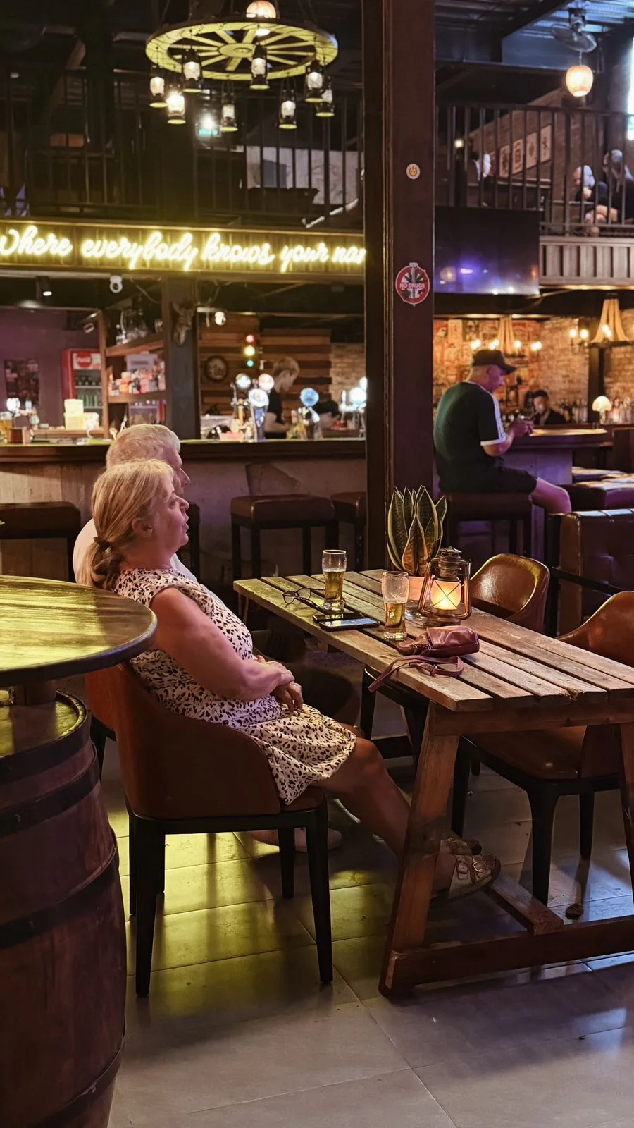 A guest enjoying an evening at the Cheers bar