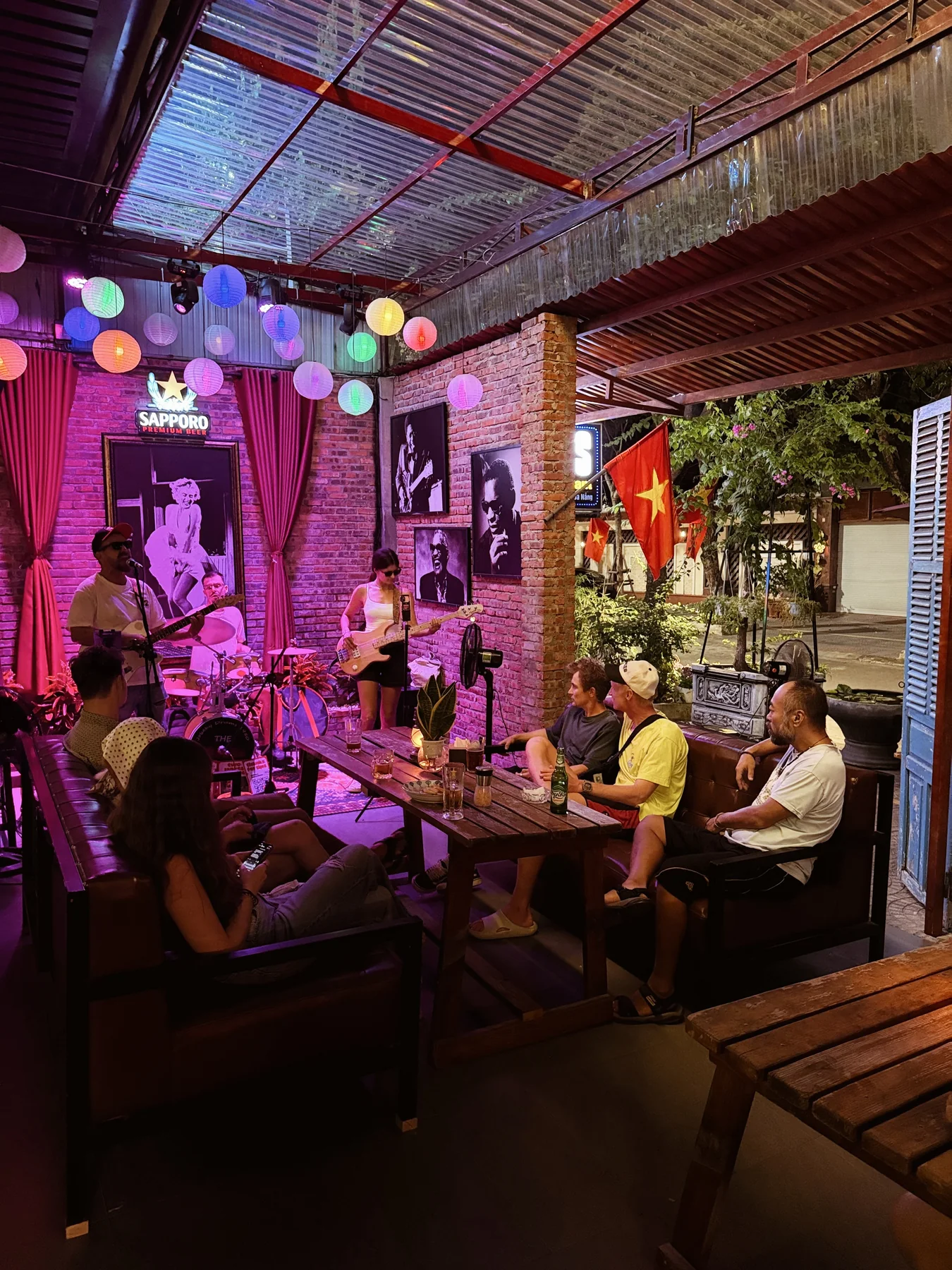 Guests enjoying live music in the warmly lit Cheers pub